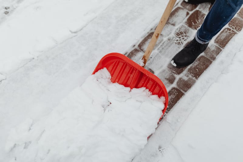 Front walkway and steps of a house under fresh snow
